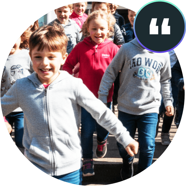 A group of children sharing a happy moment, used as a domiciliary care testimonial