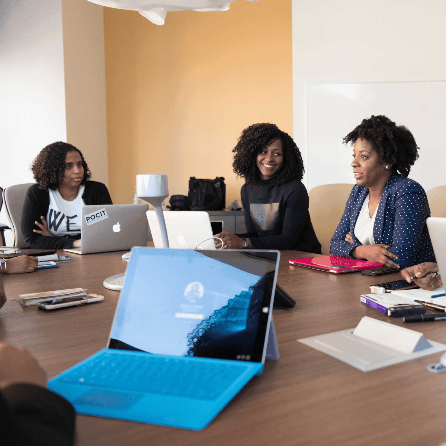 A team of professionals in a bright office, representing a software implementation hero image