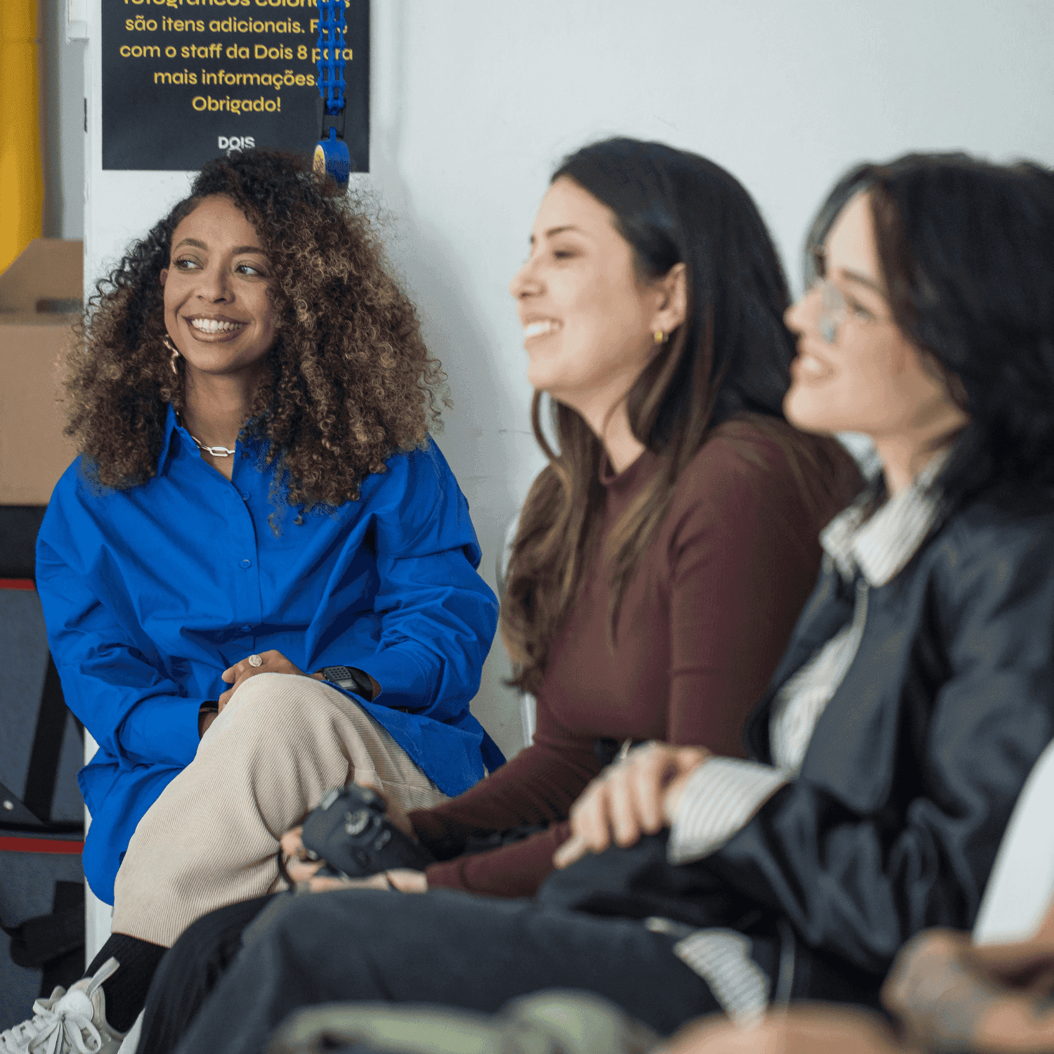 A group of women in a workplace meeting discussing implementation steps