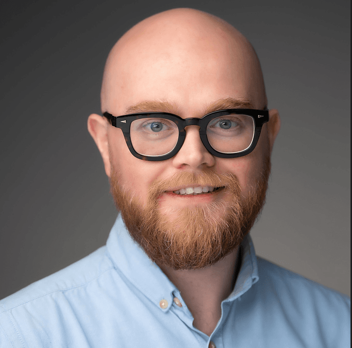 Professional headshot of Mark F wearing glasses, second option photo